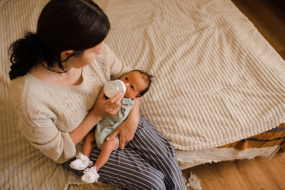 Mother Bottle Feeding Baby